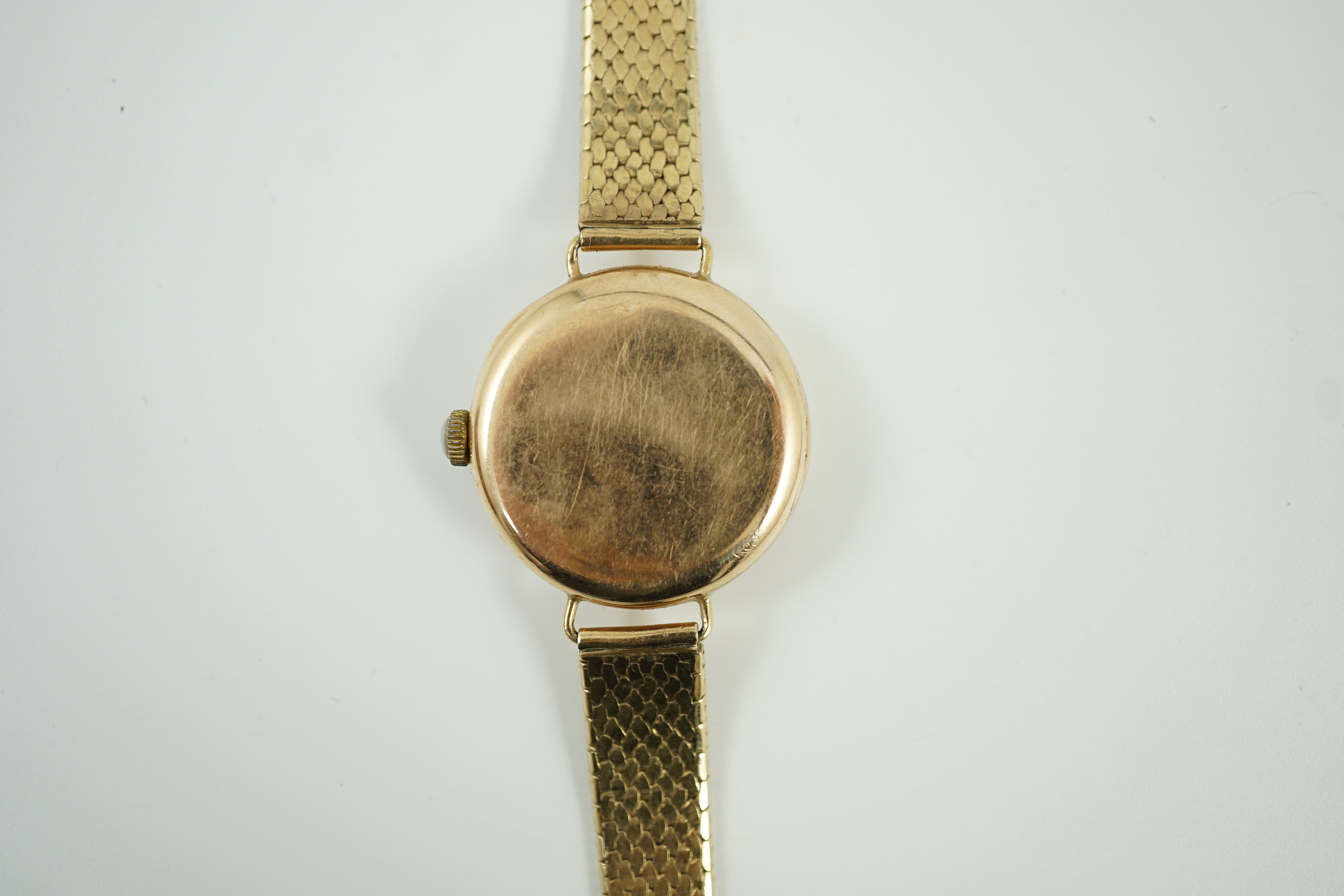 A lady's 1920's 9ct gold Omega manual wind wrist watch, on a later 9ct gold strap, overall 18.5cm, gross weight 33.2 grams.